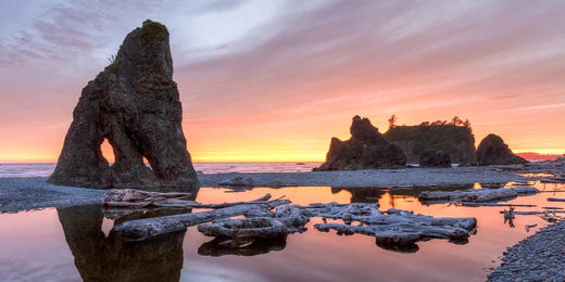 Rock formations at a purple pink sunset on the Washington Coast